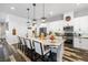 Beautiful kitchen island with marble counters, stainless steel appliances, and bar stool seating at 417 Honeybrush Ave, Henderson, NV 89011