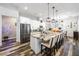 Kitchen island with granite counters, stainless steel appliances, and pendant lighting at 417 Honeybrush Ave, Henderson, NV 89011