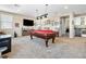 Expansive living room with a pool table, television, and beverage cooler at 417 Honeybrush Ave, Henderson, NV 89011