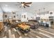 Bright and open living area featuring hardwood floors, plush seating and modern lighting at 417 Honeybrush Ave, Henderson, NV 89011