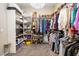 A generously sized walk-in closet offers ample storage with organized shelving and hanging racks for clothing and accessories at 417 Honeybrush Ave, Henderson, NV 89011