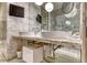 Bathroom featuring dual sinks, a marble countertop, and a modern design at 4381 W Flamingo Rd # 901, Las Vegas, NV 89103