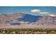 Expansive city views meet majestic mountains in this scenic shot, offering a serene escape with natural beauty at 4381 W Flamingo Rd # 901, Las Vegas, NV 89103