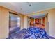 Hallway featuring an elevator, decorative carpet and neutral wall colors at 4381 W Flamingo Rd # 901, Las Vegas, NV 89103
