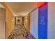 Condo hallway featuring patterned carpet and neutral wall colors at 4381 W Flamingo Rd # 901, Las Vegas, NV 89103
