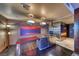 Modern stainless kitchen with a wooden breakfast bar and ambient lighting, perfect for entertaining at 4381 W Flamingo Rd # 901, Las Vegas, NV 89103