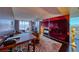 Open-concept living room featuring a fireplace, dining table, and city views at 4381 W Flamingo Rd # 901, Las Vegas, NV 89103