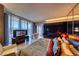 Bright main bedroom with city views, a soaking tub, and dark wood accents at 4381 W Flamingo Rd # 901, Las Vegas, NV 89103