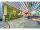 Outdoor poolside bar featuring a vibrant green accent wall and ample seating at 4381 W Flamingo Rd # 901, Las Vegas, NV 89103