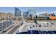 Las Vegas skyline view from a balcony, featuring vibrant city buildings, roads, and parking lots at 4525 Dean Martin Dr # 901, Las Vegas, NV 89103