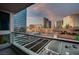 Balcony view overlooking the city, featuring sleek glass railings and views of the city skyline at 4525 Dean Martin Dr # 901, Las Vegas, NV 89103