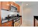 Modern kitchen features stainless steel appliances and dark granite countertops at 4525 Dean Martin Dr # 901, Las Vegas, NV 89103
