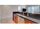 Modern kitchen features stainless steel appliances, dark granite countertops, and dark wood cabinets at 4525 Dean Martin Dr # 901, Las Vegas, NV 89103