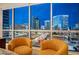 Charming living area featuring stunning city views through expansive windows at 4525 Dean Martin Dr # 901, Las Vegas, NV 89103