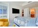 Bright main bedroom featuring skyline views, modern fixtures, and convenient access to bathroom and kitchen at 4525 Dean Martin Dr # 901, Las Vegas, NV 89103