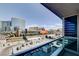 City view from a high-rise balcony showing commercial buildings and parking structures at 4525 Dean Martin Dr # 901, Las Vegas, NV 89103