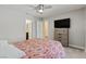 Bright bedroom with soft carpet, ceiling fan, window, and stylish dresser at 4559 Dover Straight St, Las Vegas, NV 89115