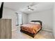 Cozy bedroom with carpet, ceiling fan, window, and dresser at 4559 Dover Straight St, Las Vegas, NV 89115