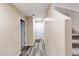 Bright entryway features sleek wood flooring, staircase, and access to other rooms at 4559 Dover Straight St, Las Vegas, NV 89115