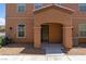 Inviting two-story home featuring a covered porch and well-maintained gravel landscaping at 4559 Dover Straight St, Las Vegas, NV 89115