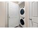 Convenient laundry room featuring a stacked washer and dryer unit at 4559 Dover Straight St, Las Vegas, NV 89115