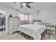 Bright bedroom with wood-look floors, features a bed, dresser and closet at 4629 San Cir, Las Vegas, NV 89120
