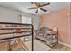 Cozy bedroom features a combo bunkbed and crib, and modern ceiling fan at 4629 San Cir, Las Vegas, NV 89120