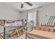Shared bedroom with a bunk bed and twin size bed, carpet, toys, and window for natural light at 4629 San Cir, Las Vegas, NV 89120