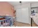 Cozy bedroom with light wood floors, closet, and a crib, perfect for a Bedroom at 4629 San Cir, Las Vegas, NV 89120