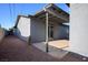 Backyard featuring a covered patio and rock landscaping, offering a low-maintenance outdoor space at 4797 E Imperial Ave, Las Vegas, NV 89104