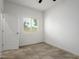 Inviting bedroom featuring tile floors and a window with natural light at 4797 E Imperial Ave, Las Vegas, NV 89104