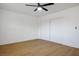 A clean bedroom featuring light wood flooring and a large closet with sliding doors at 4797 E Imperial Ave, Las Vegas, NV 89104