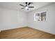 Clean bedroom with light wood flooring and a ceiling fan providing ample light and ventilation at 4797 E Imperial Ave, Las Vegas, NV 89104