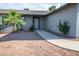 Home's front entry features a desert-landscaped yard and covered entryway at 4797 E Imperial Ave, Las Vegas, NV 89104