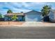 Charming single-story home features a two-car garage, desert landscaping, and neutral paint at 4797 E Imperial Ave, Las Vegas, NV 89104