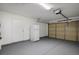 Spacious garage with epoxy flooring, white refrigerator, and a standard-size garage door at 4797 E Imperial Ave, Las Vegas, NV 89104