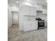 Stylish kitchen featuring white cabinets, stainless steel appliances, and modern countertops at 4797 E Imperial Ave, Las Vegas, NV 89104