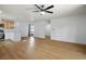 Open-concept living space featuring luxury vinyl plank flooring, ceiling fan, and an eat-in kitchen at 4797 E Imperial Ave, Las Vegas, NV 89104