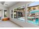View from the bedroom to a backyard pool and a spa with a waterfall at 48 Panorama Crest Ave, Las Vegas, NV 89135
