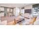 Open concept living room with modern decor, neutral colors, laminate floors, and a view of the dining area at 4955 Sage Mesa Ave # Lot 150, Las Vegas, NV 89139