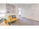 Comfortable sitting area with cozy armchairs, decorative pillows, and neutral-toned walls with photo decor at 4955 Sage Mesa Ave # Lot 150, Las Vegas, NV 89139