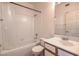 Bathroom featuring a tub with tile surround, toilet, and vanity with sink at 4960 Harrison Dr # 214, Las Vegas, NV 89120