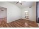 Bedroom showcasing hardwood floors, natural light, and access to an en-suite bathroom at 4960 Harrison Dr # 214, Las Vegas, NV 89120
