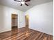 Bright bedroom with hardwood floors, a walk-in closet, and access to another room at 4960 Harrison Dr # 214, Las Vegas, NV 89120