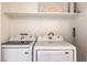 Laundry area features a top-load washing machine and front-load dryer at 4960 Harrison Dr # 214, Las Vegas, NV 89120
