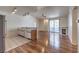 Open floor plan featuring kitchen with stainless steel appliances and bright living room with fireplace at 4960 Harrison Dr # 214, Las Vegas, NV 89120
