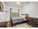 Cozy bedroom with wood floors, a modern dresser, and lots of natural light at 499 Eagle Vista Dr, Henderson, NV 89012