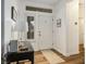 Bright entryway featuring a white front door, sidelight, and tile flooring leading into the home at 499 Eagle Vista Dr, Henderson, NV 89012