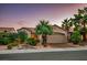 Charming single-story home featuring a two-car garage, desert landscaping and inviting curb appeal at 499 Eagle Vista Dr, Henderson, NV 89012
