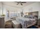 This main bedroom boasts a seating area, beautiful flooring, and an abundance of natural light at 499 Eagle Vista Dr, Henderson, NV 89012